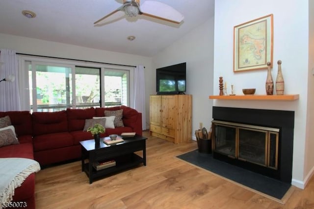 21 Crabapple Ln, Franklin Twp, NJ 08823 - living area with lofted ceiling, light wood-style flooring, a ceiling fan, and a glass covered fireplace