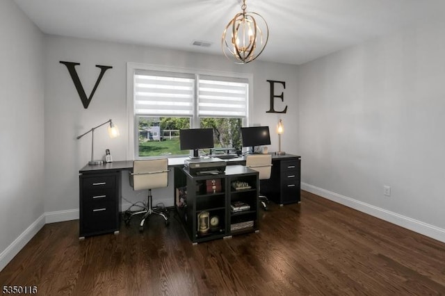 office space with baseboards, visible vents, dark wood-style flooring, and a notable chandelier