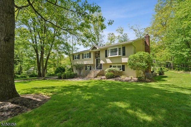 15 Longhill Rd, Randolph Twp, NJ 07869 - view of front facade with a chimney and a front lawn