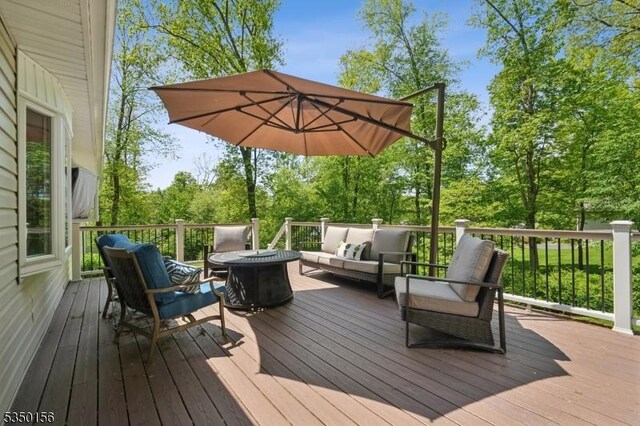 15 Longhill Rd, Randolph Twp, NJ 07869 - deck featuring an outdoor living space with a fire pit