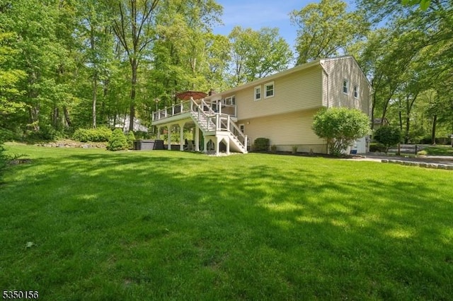 15 Longhill Rd, Randolph Twp, NJ 07869 - back of house with stairway, a yard, a deck, and an attached garage