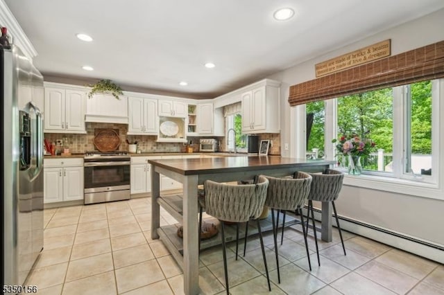 15 Longhill Rd, Randolph Twp, NJ 07869 - kitchen featuring appliances with stainless steel finishes, a sink, dark countertops, white cabinetry, and recessed lighting