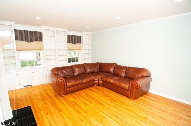 living room with visible vents, recessed lighting, and light wood-type flooring