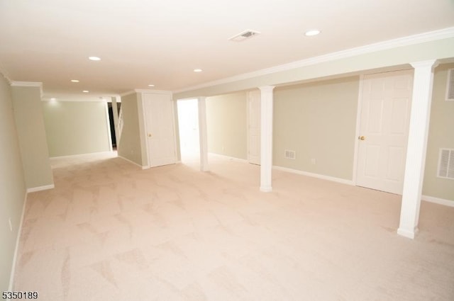 finished basement featuring crown molding and light carpet
