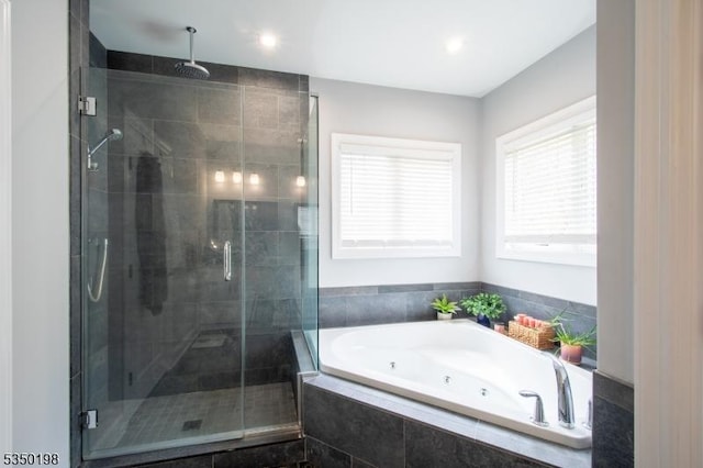 full bath featuring a whirlpool tub, recessed lighting, and a stall shower