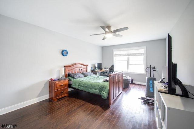bedroom with baseboards, ceiling fan, and wood finished floors