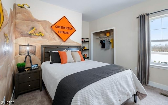carpeted bedroom featuring a closet, baseboards, and visible vents