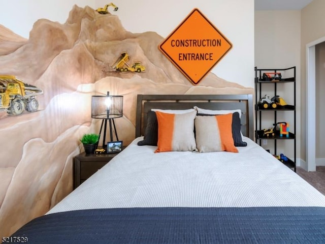 bedroom with carpet floors and baseboards