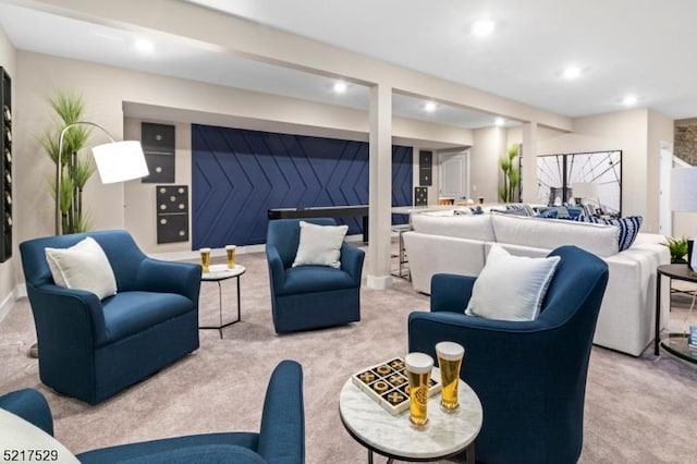 carpeted living area with recessed lighting