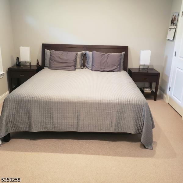 carpeted bedroom with baseboards