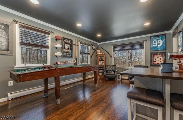 recreation room featuring baseboards, wood finished floors, recessed lighting, and ornamental molding