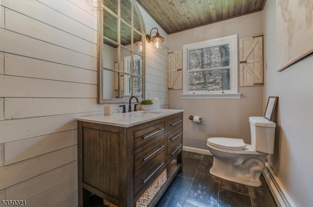 bathroom featuring toilet, baseboards, baseboard heating, wooden ceiling, and vanity