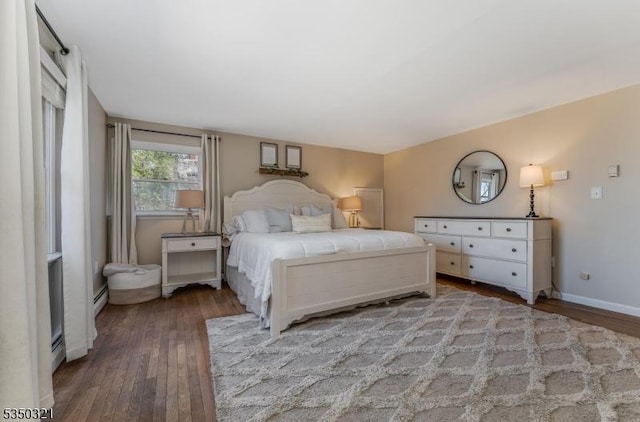 bedroom featuring wood-type flooring and baseboards