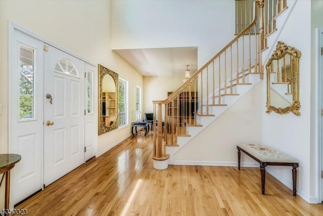 74 Rose Morrow Rd, Wantage Twp, NJ 07461 - foyer entrance featuring wood finished floors, stairway, and a towering ceiling