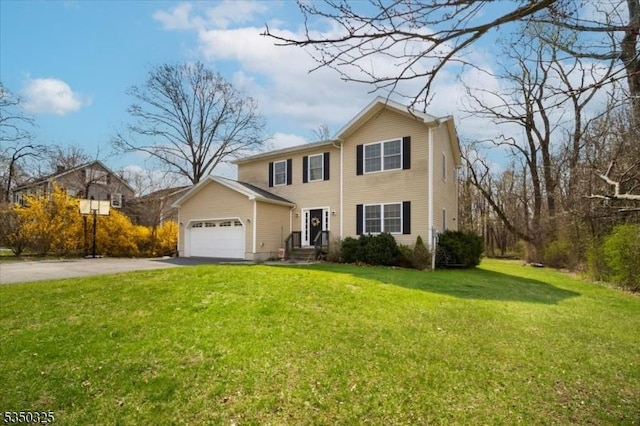 traditional home with driveway, a garage, and a front yard