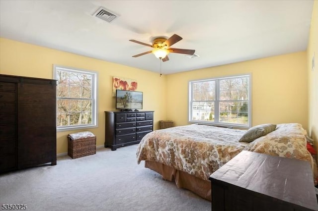bedroom with carpet, visible vents, baseboards, and a ceiling fan
