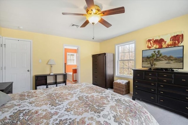 bedroom with visible vents, a ceiling fan, and carpet floors