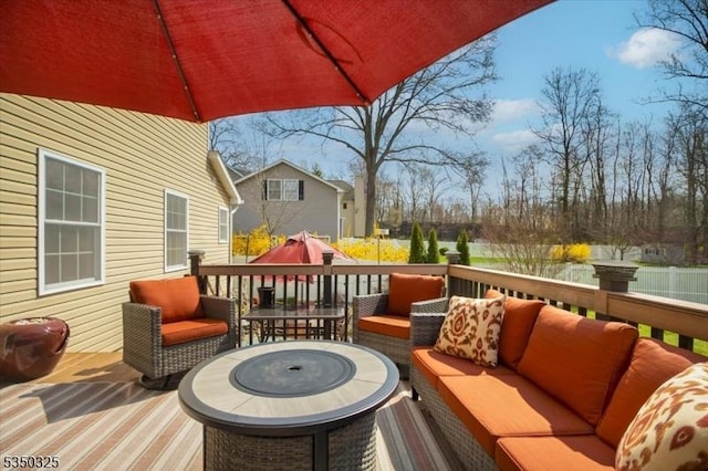wooden deck with an outdoor living space