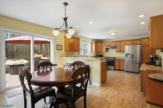dining area featuring light tile patterned floors, recessed lighting, and a chandelier