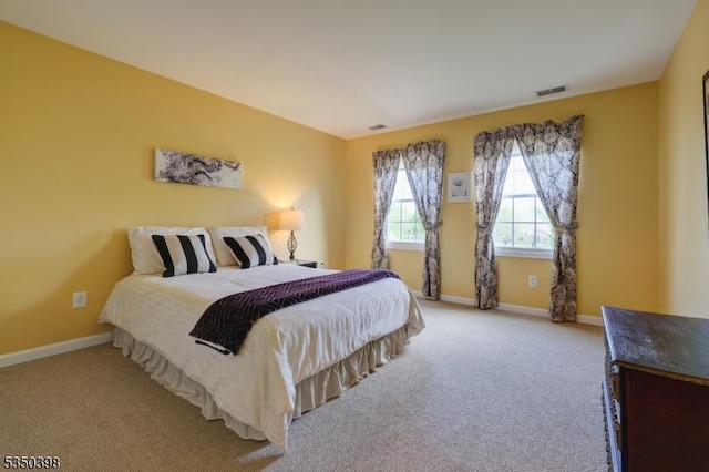 bedroom featuring carpet flooring and baseboards