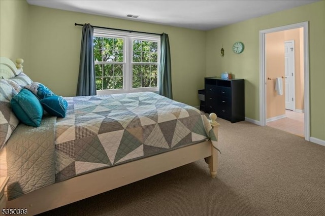 bedroom featuring carpet and baseboards