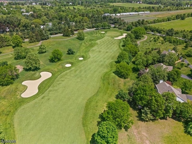 aerial view of property's location with a golf club