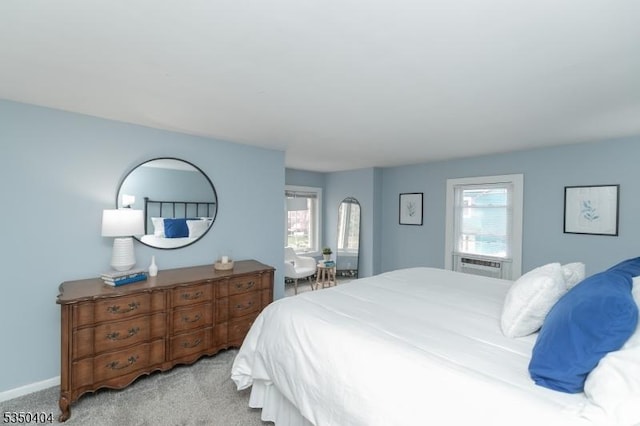 bedroom with carpet floors, cooling unit, and baseboards