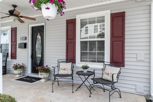 property entrance with a porch and ceiling fan