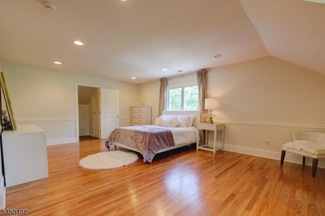 bedroom with light wood-style flooring, baseboards, lofted ceiling, and recessed lighting