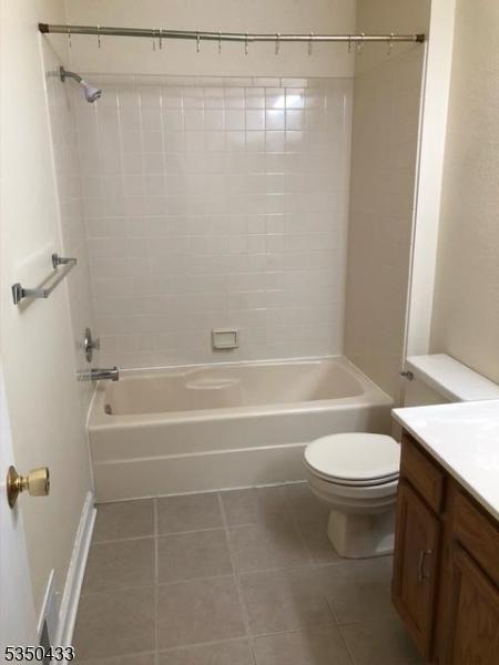 84 Wentworth Rd, Bedminster Twp, NJ 07921 - full bathroom featuring tile patterned flooring, toilet, vanity, washtub / shower combination, and baseboards