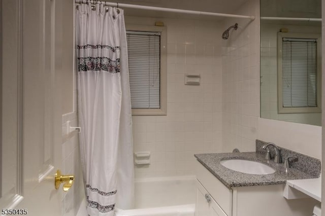 full bath with shower / bath combo with shower curtain and vanity