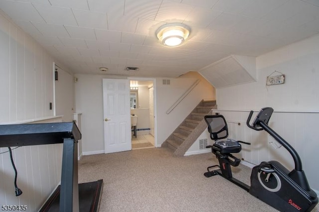 exercise room featuring visible vents and carpet flooring