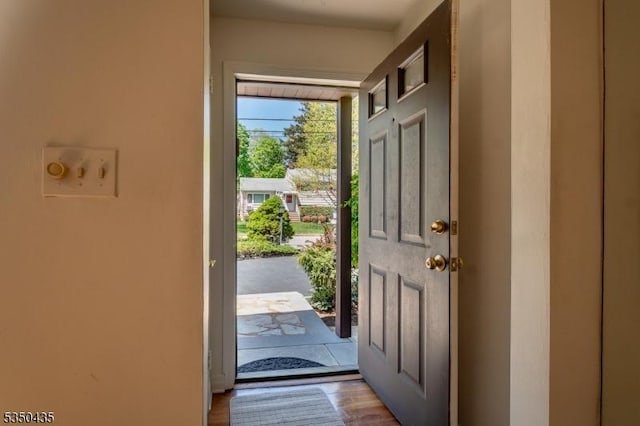 doorway with wood finished floors