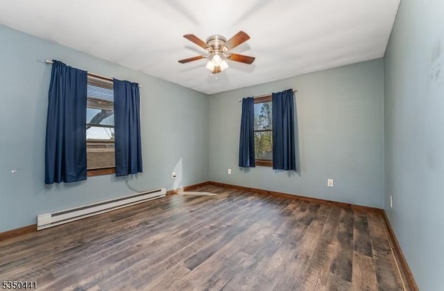 empty room with a ceiling fan, baseboards, a baseboard heating unit, and wood finished floors