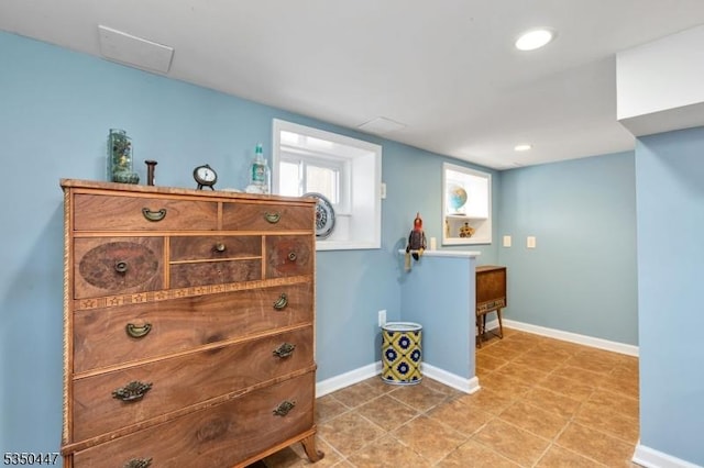 interior space featuring baseboards and recessed lighting