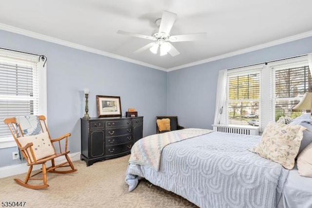 bedroom with carpet flooring, baseboards, ornamental molding, and ceiling fan
