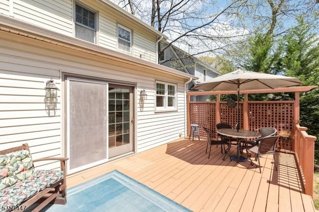 wooden deck with outdoor dining area