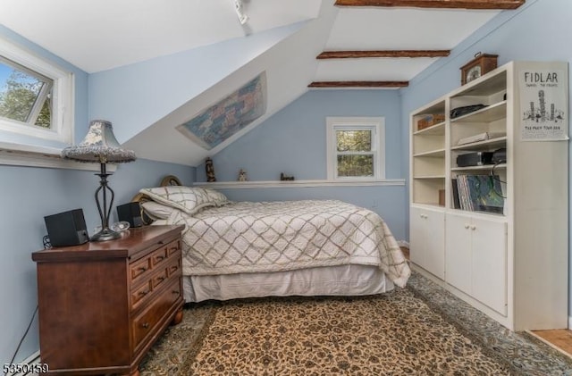 bedroom with lofted ceiling