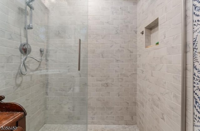bathroom with a shower stall
