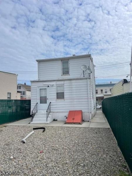 27 Edwin St, Carteret Boro, NJ 07008 - back of property with entry steps and a fenced backyard