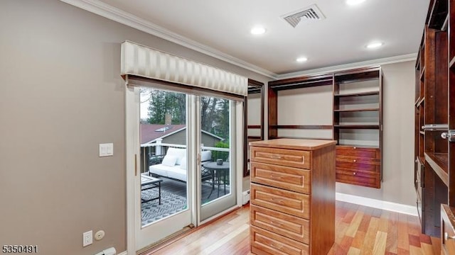 walk in closet featuring light wood-style floors and visible vents