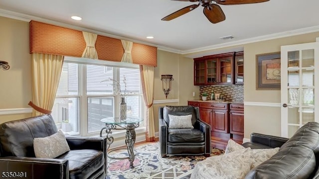 living room featuring recessed lighting, crown molding, and a ceiling fan