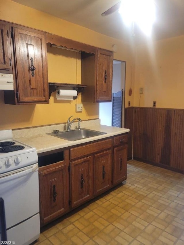 50 Coolidge Trl, Hopatcong Boro, NJ 07843 - kitchen featuring exhaust hood, white electric stove, a sink, light countertops, and brick patterned floor