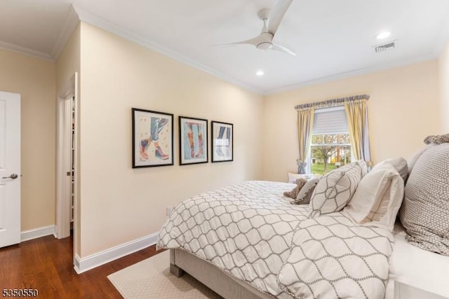 bedroom with crown molding, dark wood finished floors, baseboards, visible vents, and recessed lighting
