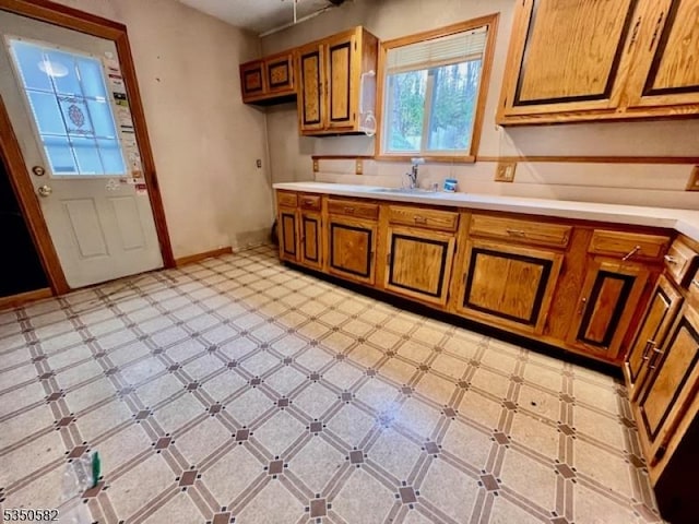 32 High St, Blairstown Twp, NJ 07825 - kitchen featuring brown cabinetry, light flooring, light countertops, and a sink