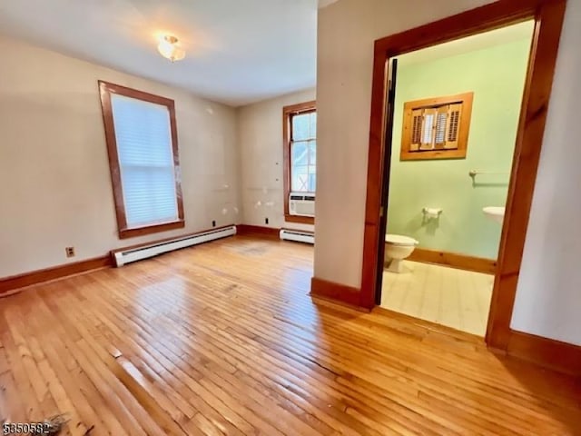 32 High St, Blairstown Twp, NJ 07825 - unfurnished room with a baseboard heating unit, wood-type flooring, baseboards, and cooling unit