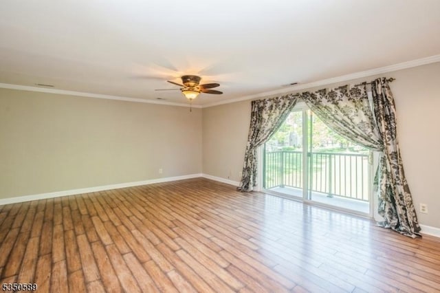 unfurnished room featuring a ceiling fan, light wood-type flooring, baseboards, and ornamental molding