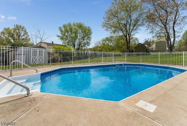 view of pool featuring fence, a fenced in pool, and a patio area