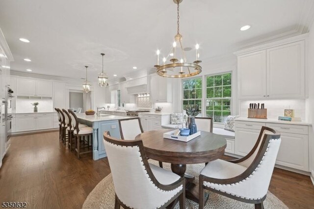 260 Hartshorn Dr, Millburn Twp, NJ 07078 - dining area featuring a chandelier, dark wood-type flooring, ornamental molding, and recessed lighting
