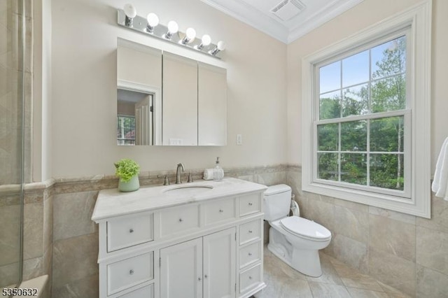 260 Hartshorn Dr, Millburn Twp, NJ 07078 - bathroom featuring tile walls, healthy amount of natural light, toilet, crown molding, and vanity